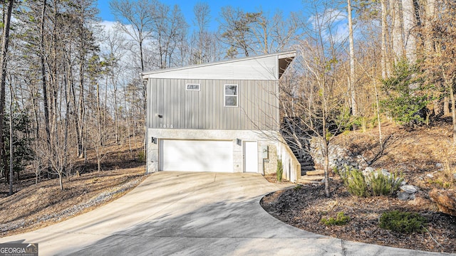 view of side of property featuring a garage