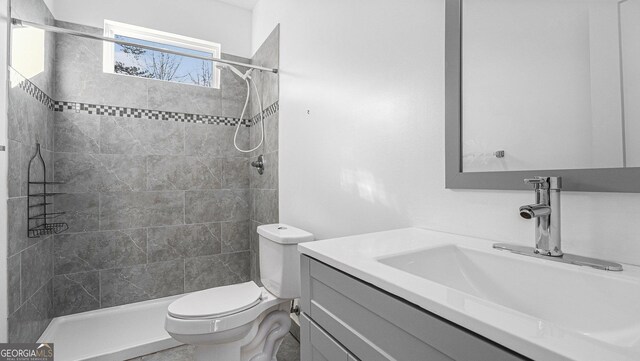 kitchen with appliances with stainless steel finishes, a center island, white cabinets, and decorative light fixtures