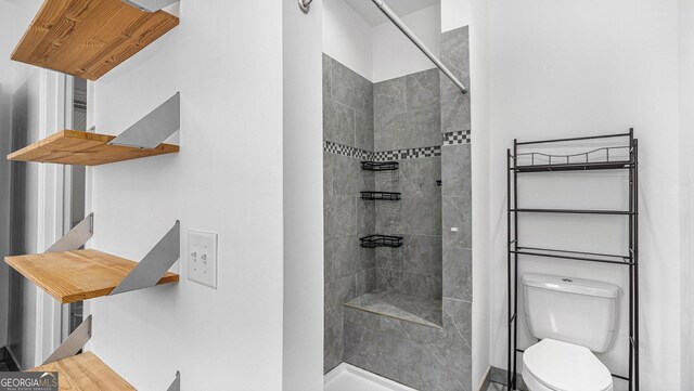 bathroom with vanity, a bathtub, and tile walls