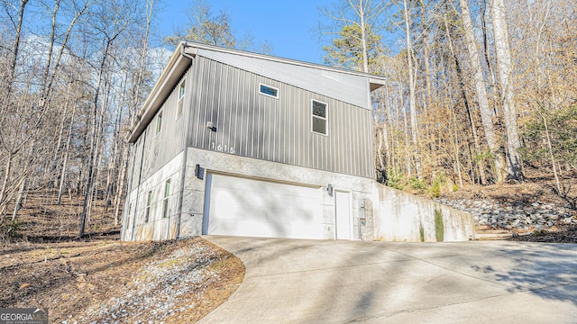 view of side of home with a garage