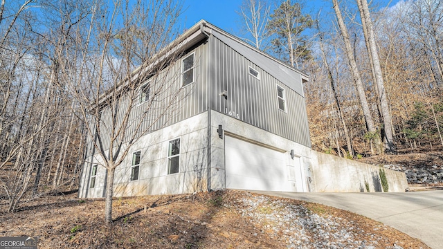 view of side of home featuring a garage