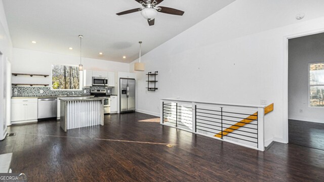 unfurnished living room with dark hardwood / wood-style floors