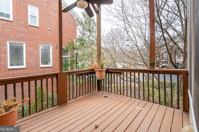 wooden deck featuring ceiling fan