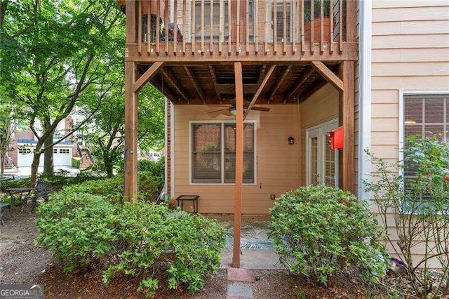 entrance to property featuring ceiling fan and a balcony