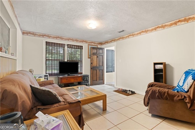 tiled living room with a textured ceiling