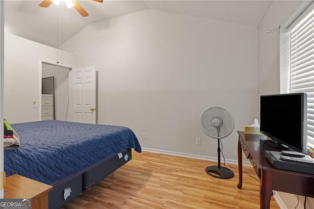 bedroom featuring lofted ceiling, hardwood / wood-style floors, and ceiling fan