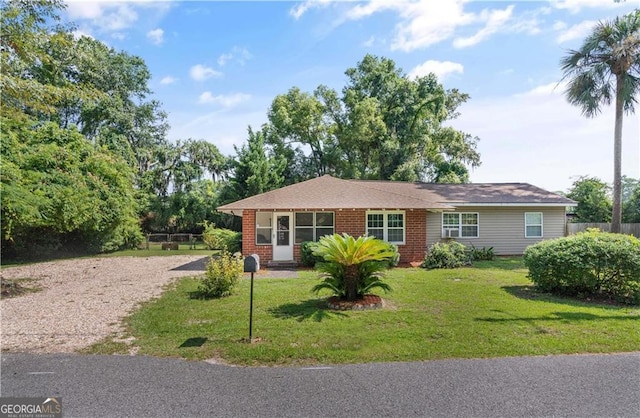 single story home with a front yard