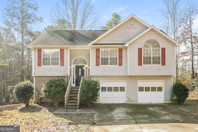 bi-level home featuring a garage