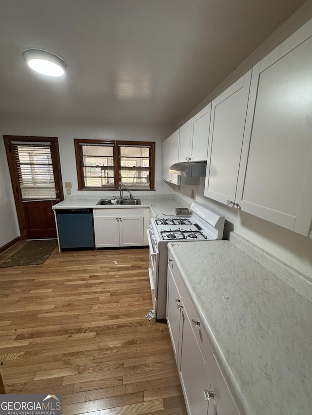 kitchen with sink, dishwasher, plenty of natural light, white cabinets, and white range with gas cooktop