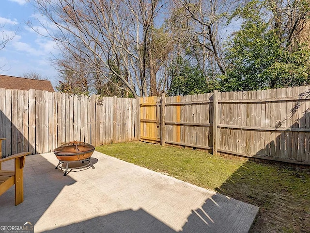 view of yard with a patio area and a fire pit