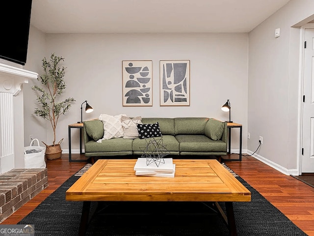 living room with dark hardwood / wood-style flooring