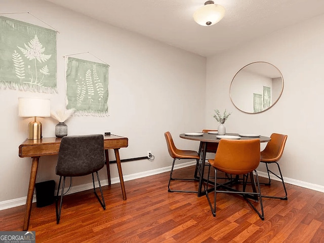 dining room featuring wood-type flooring