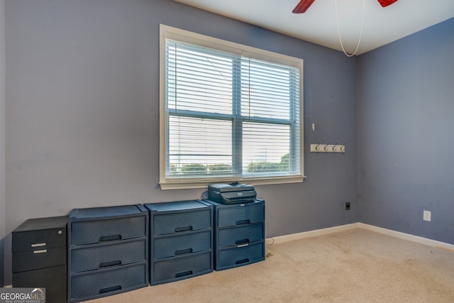 interior space with light colored carpet and ceiling fan