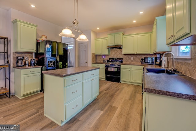 kitchen featuring a center island, sink, light hardwood / wood-style floors, and black appliances