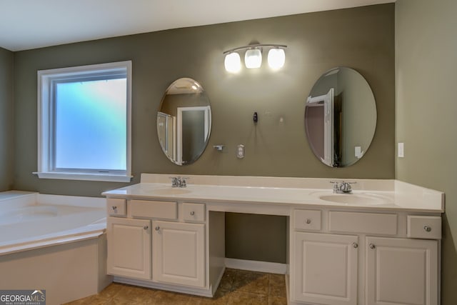 bathroom featuring vanity and a tub to relax in