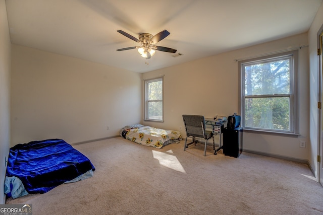 carpeted bedroom with ceiling fan