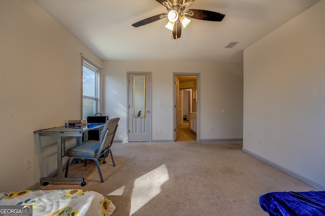 office area with light colored carpet and ceiling fan