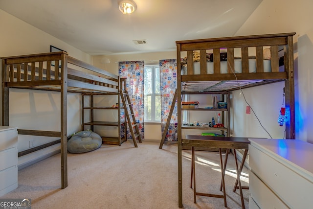 bedroom with light colored carpet