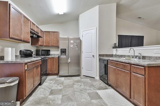 kitchen with vaulted ceiling, sink, and black appliances