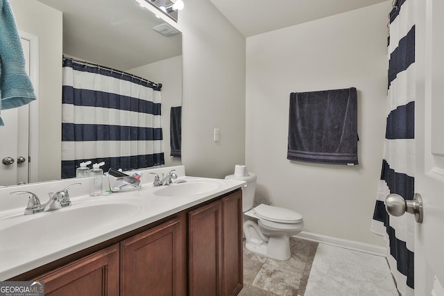 bathroom with vanity and toilet