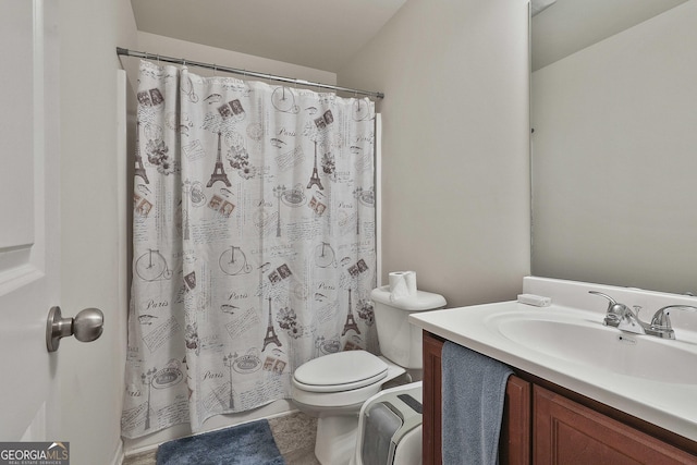 bathroom with vanity, toilet, and a shower with shower curtain