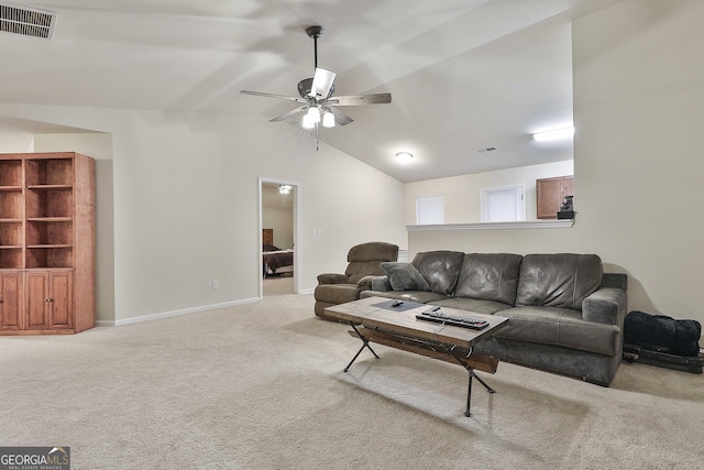 carpeted living room featuring a ceiling fan, lofted ceiling, visible vents, and baseboards