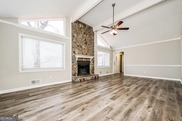 unfurnished living room featuring hardwood / wood-style floors, high vaulted ceiling, a fireplace, beamed ceiling, and ceiling fan