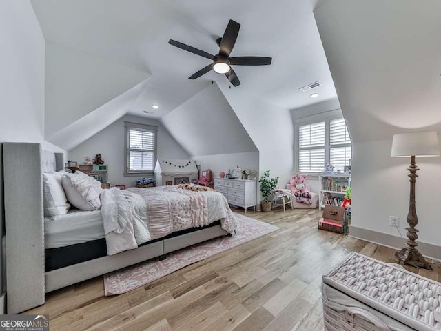 bedroom with vaulted ceiling, ceiling fan, and light hardwood / wood-style floors