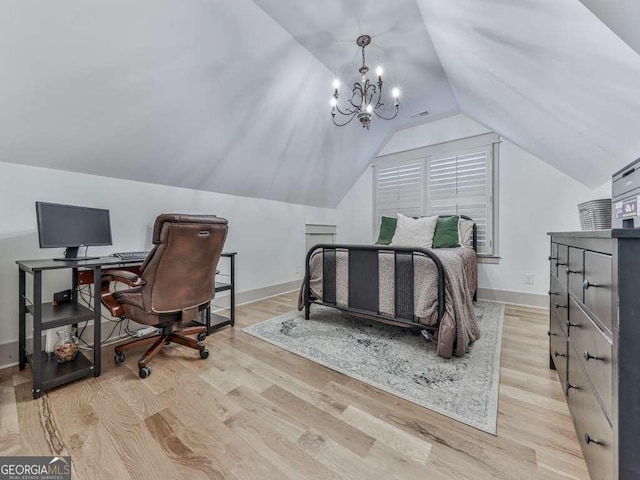 bedroom with vaulted ceiling, a chandelier, and light hardwood / wood-style floors