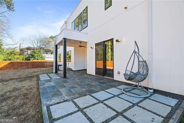 view of patio / terrace featuring ceiling fan