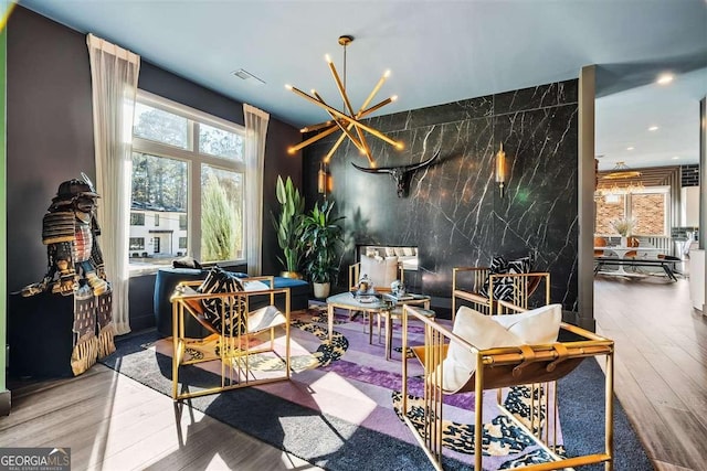 interior space featuring a notable chandelier and wood-type flooring