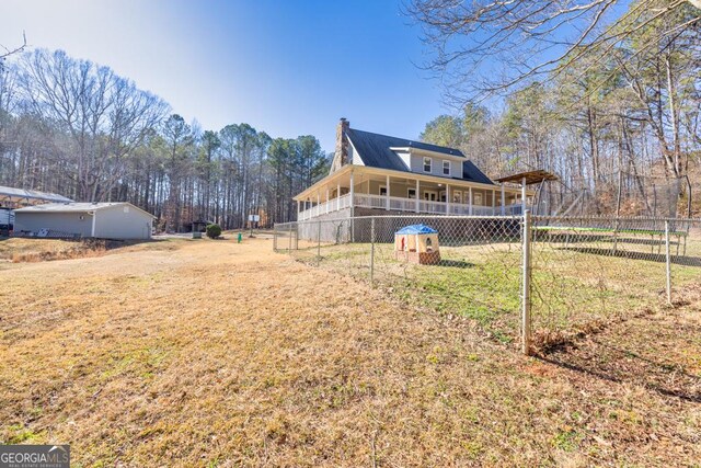 farmhouse featuring a carport and covered porch