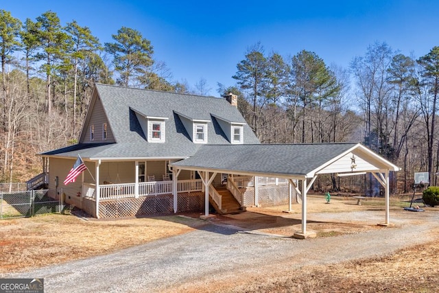 farmhouse with a carport and a porch