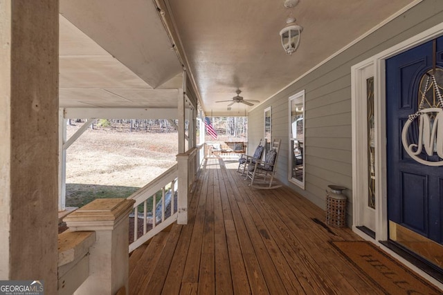 deck featuring ceiling fan and a porch