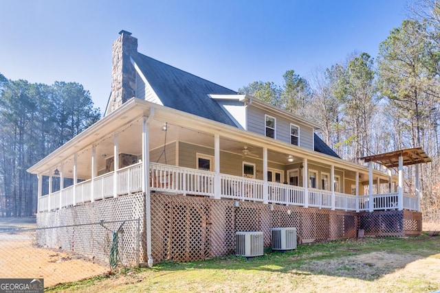 exterior space with a porch and cooling unit