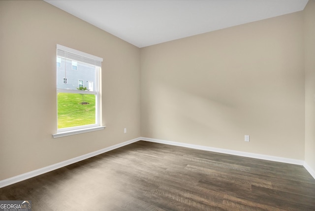 spare room featuring dark hardwood / wood-style flooring