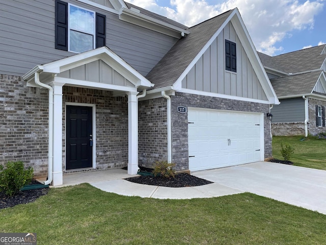 entrance to property featuring a garage, a lawn, board and batten siding, and driveway