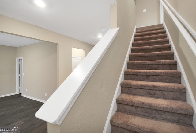 stairway featuring hardwood / wood-style flooring