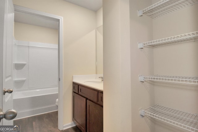 bathroom featuring vanity, toilet, and wood-type flooring