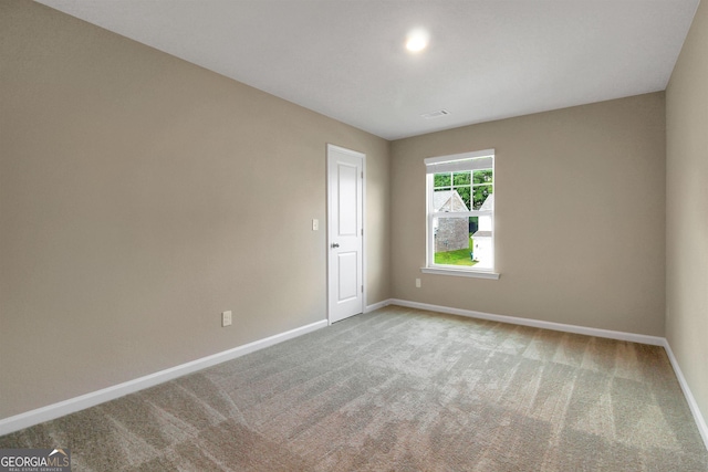 spare room with carpet floors