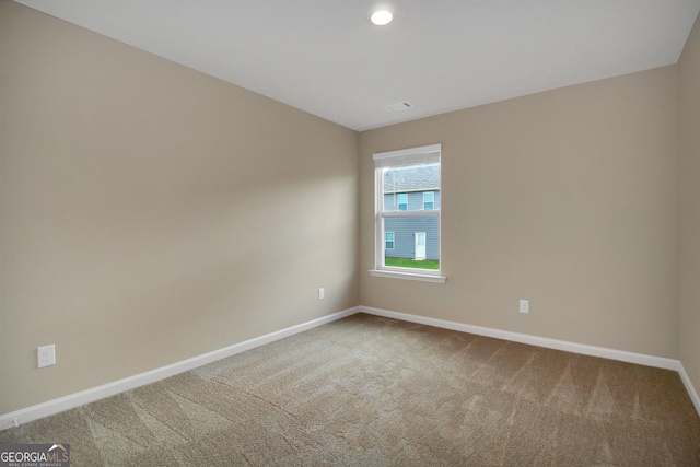 view of carpeted spare room