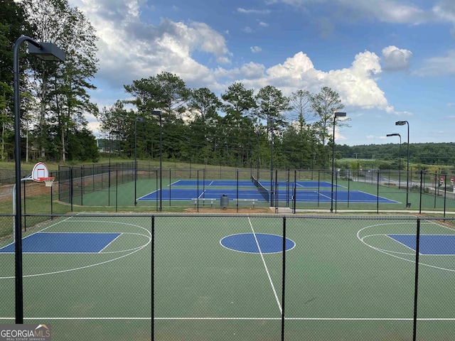 view of sport court featuring tennis court