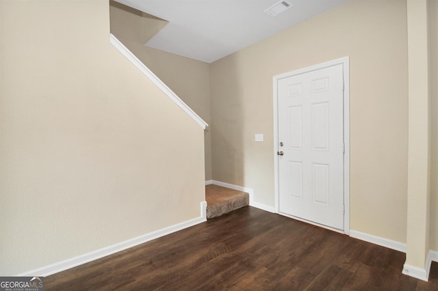 entrance foyer with dark hardwood / wood-style flooring