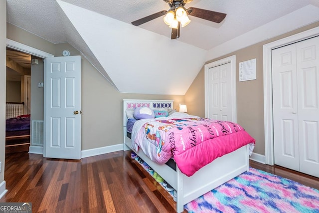 304 Stathams Way, Warner Robins, GA 31088 - bedroom with baseboards, lofted ceiling, wood finished floors, multiple closets, and a ceiling fan