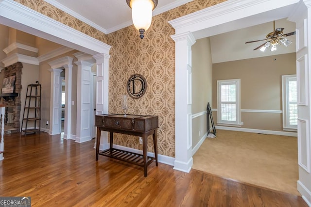 304 Stathams Way, Warner Robins, GA 31088 - hall featuring decorative columns, baseboards, wood finished floors, crown molding, and wallpapered walls