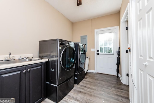 304 Stathams Way, Warner Robins, GA 31088 - laundry room with washer and dryer, light wood-style floors, and cabinet space