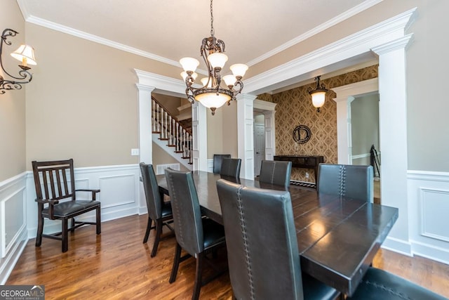 304 Stathams Way, Warner Robins, GA 31088 - dining room featuring decorative columns, wood finished floors, wainscoting, crown molding, and a decorative wall