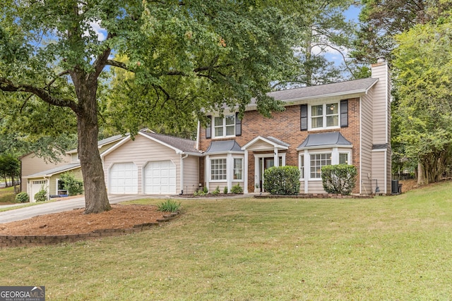 colonial house with cooling unit, a garage, and a front yard