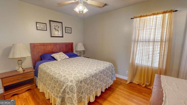 bedroom featuring wood-type flooring and ceiling fan