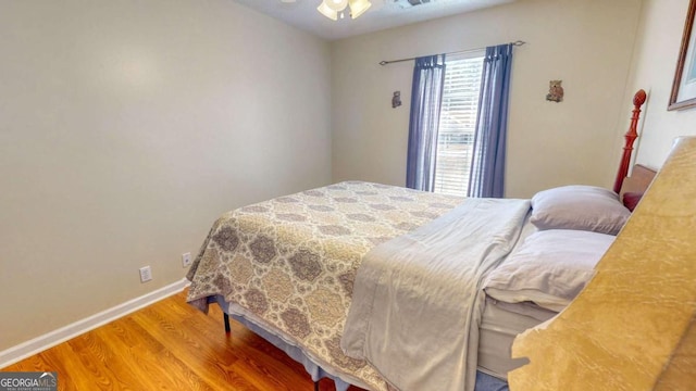 bedroom featuring hardwood / wood-style flooring